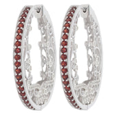 Round red garnet sterling silver earrings with intricate design and sparkling gemstones accent.